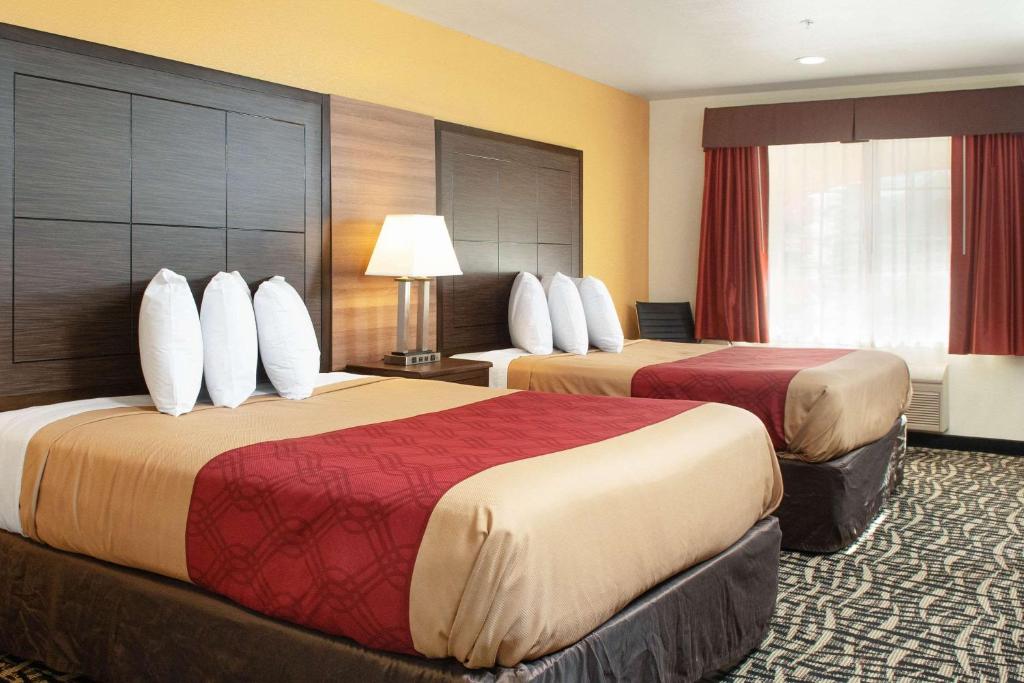 a hotel room with two beds in a room at Executive Inn westley,CA in Westley