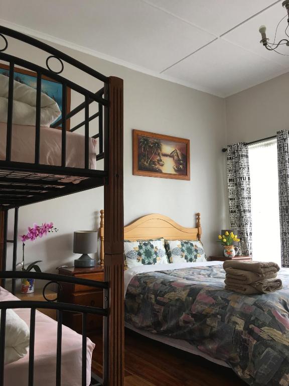 Postel nebo postele na pokoji v ubytování Mini Homestay