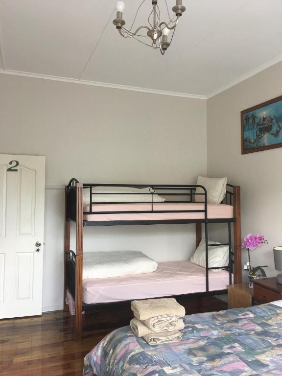 Postel nebo postele na pokoji v ubytování Mini Homestay