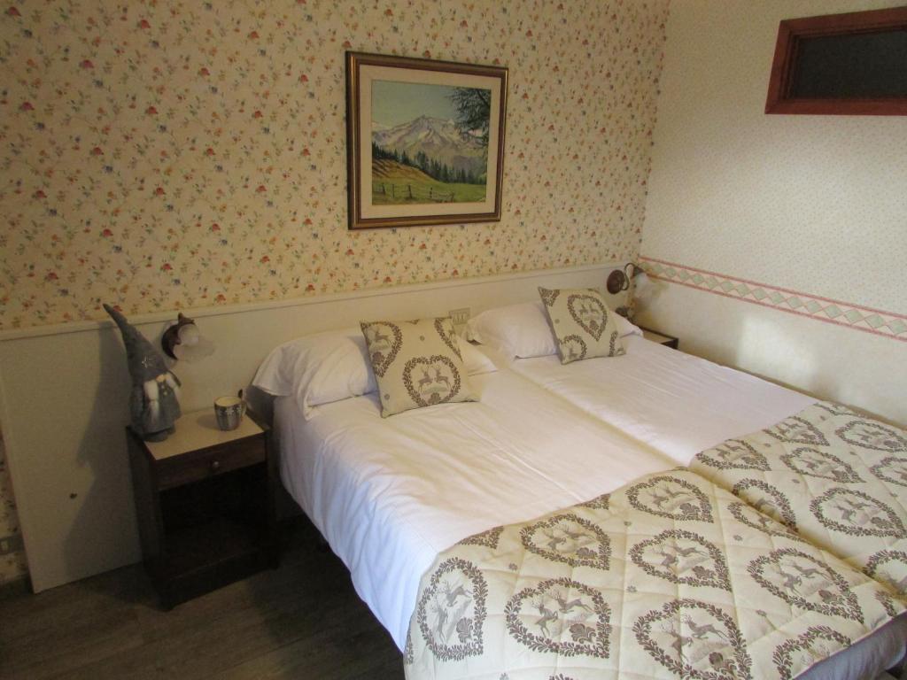 Postel nebo postele na pokoji v ubytování Hotel Meublè Meridiana