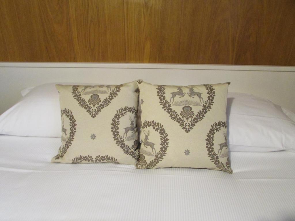 Postel nebo postele na pokoji v ubytování Hotel Meublè Meridiana