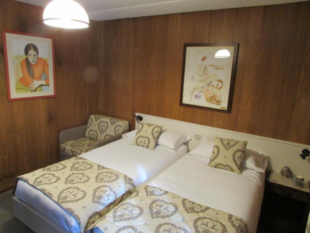 Postel nebo postele na pokoji v ubytování Hotel Meublè Meridiana