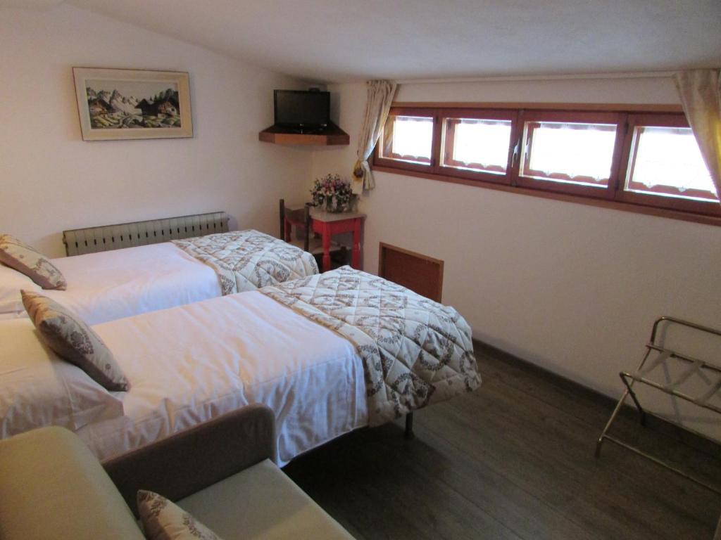 Postel nebo postele na pokoji v ubytování Hotel Meublè Meridiana