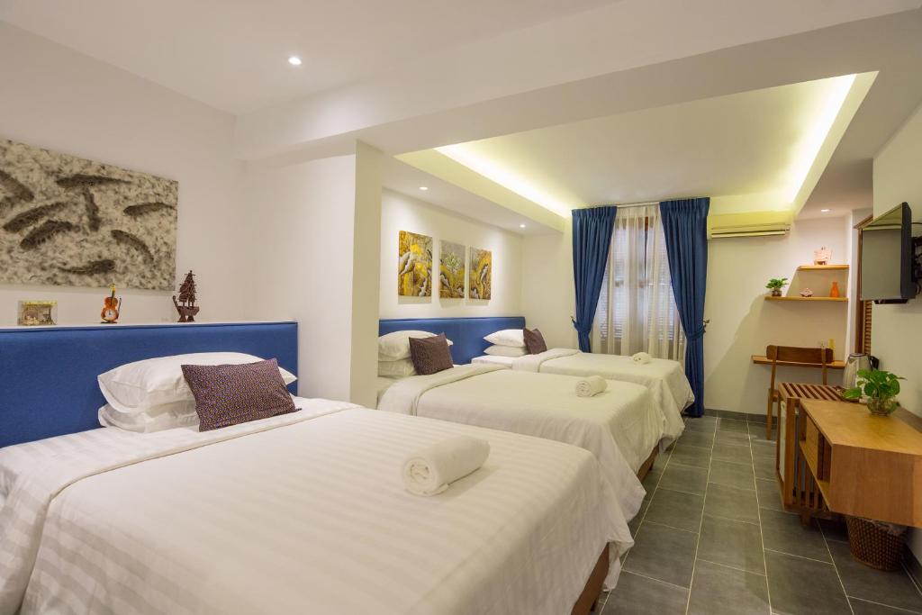 Postel nebo postele na pokoji v ubytování Neth Socheata Hotel