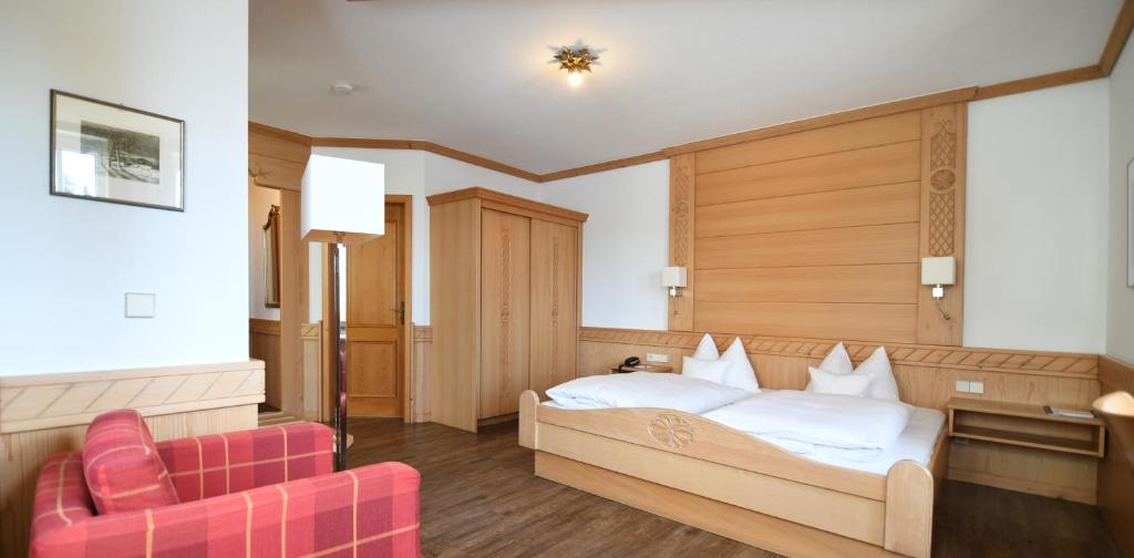 Postel nebo postele na pokoji v ubytování Hotel Wiesend
