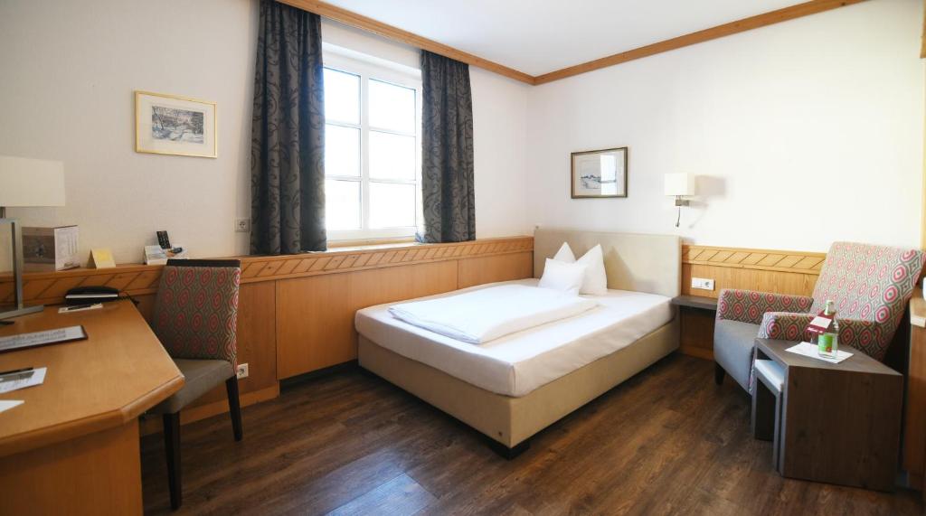 Postel nebo postele na pokoji v ubytování Hotel Wiesend