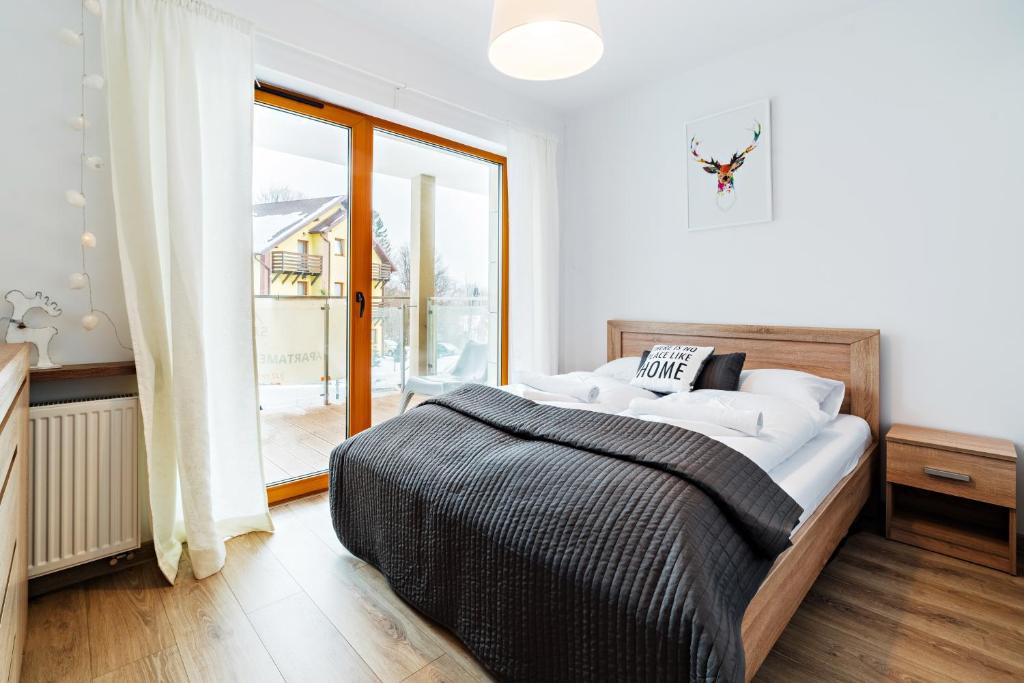 Posteľ alebo postele v izbe v ubytovaní Apartamenty Sun & Snow Sarnia Residence