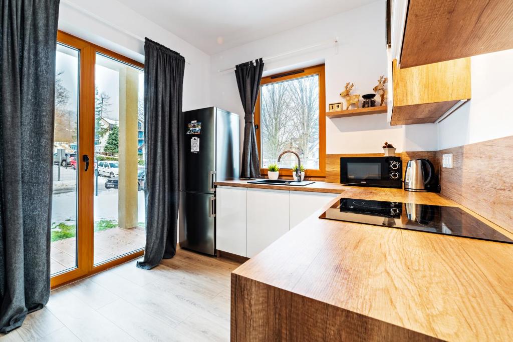 Kuchyňa alebo kuchynka v ubytovaní Apartamenty Sun & Snow Sarnia Residence