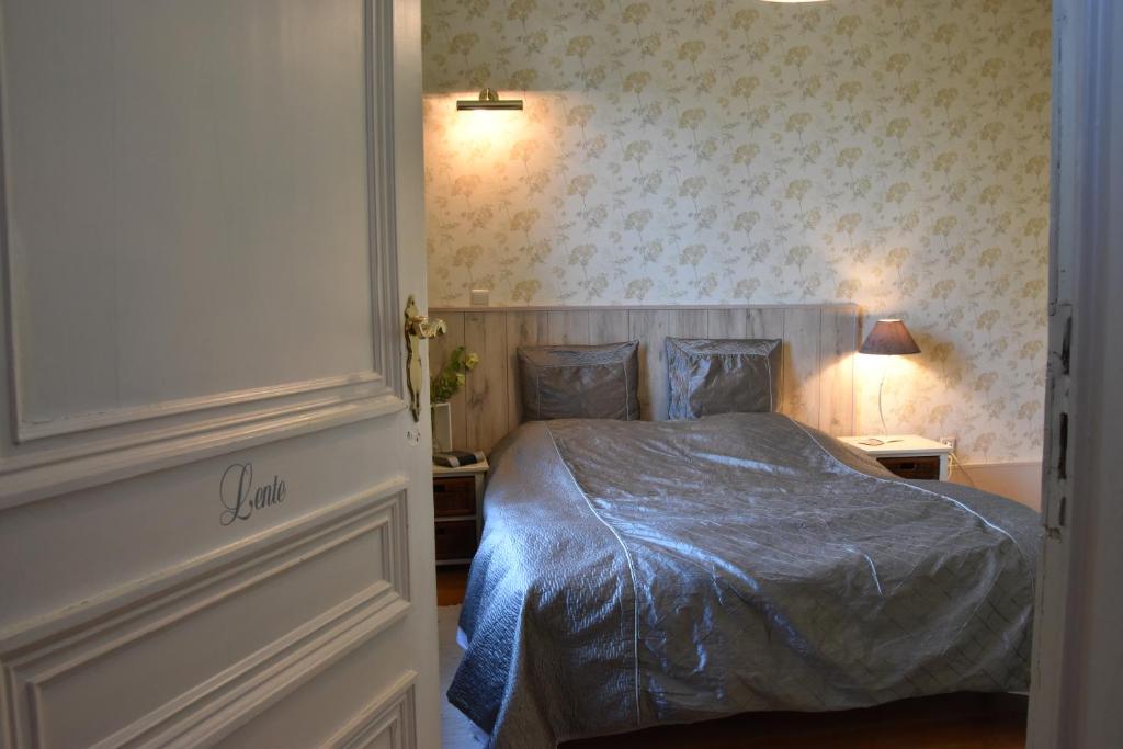 Postel nebo postele na pokoji v ubytování B&B Het Loonderhof