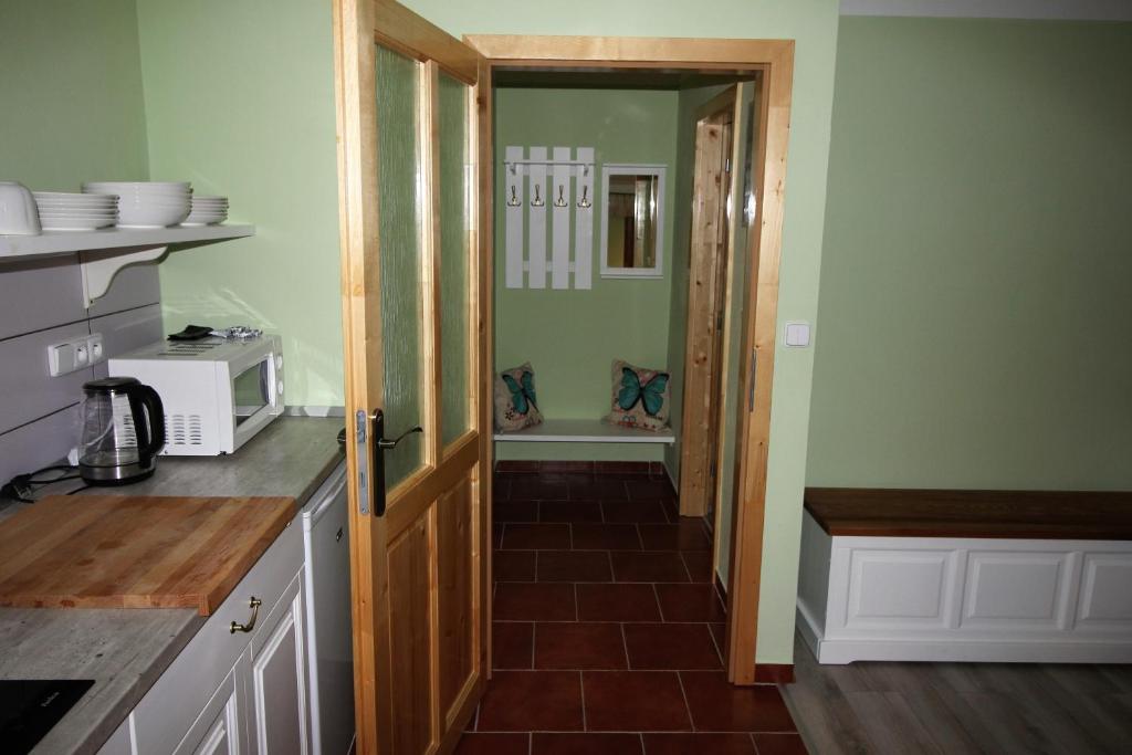 Kuchyň nebo kuchyňský kout v ubytování Apartmány u Knajflů