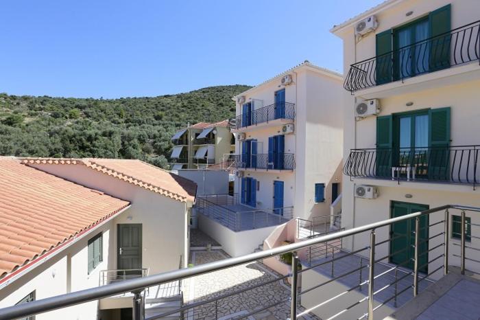 a group of buildings with balconies on the side at Ithaca's Poem Apartments in Vathi