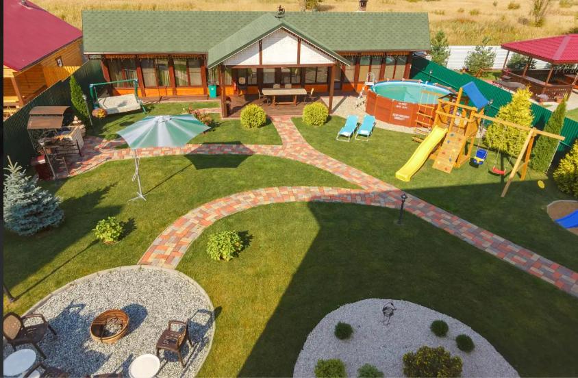 an aerial view of a backyard with a playground at Guesthouse Suzdalskiy Hutor in Suzdal