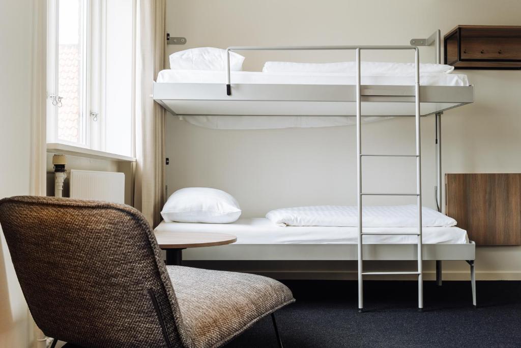 Postel nebo postele na pokoji v ubytování Copenhagen Go Hotel