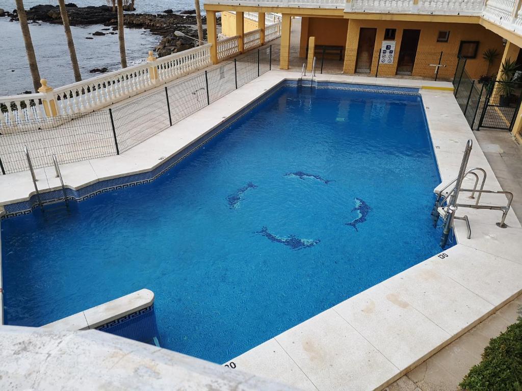 Bazén v ubytovaní Apartamento Benalmádena costa, Torremuelle alebo v jeho blízkosti