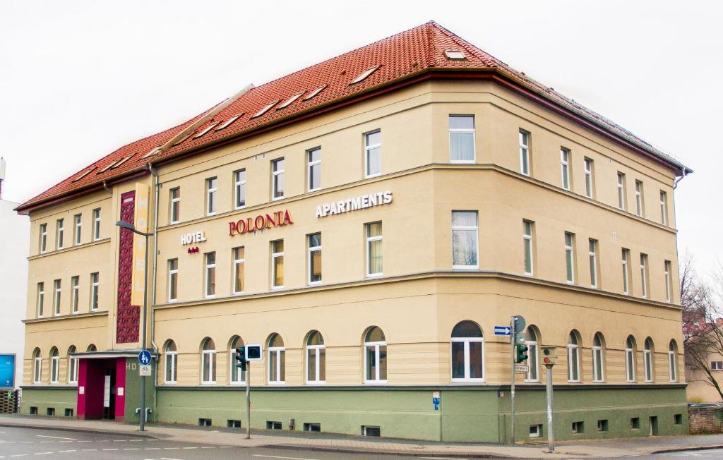 a large building on the corner of a street at Hotel Polonia - Frankfurt/Oder in Frankfurt/Oder