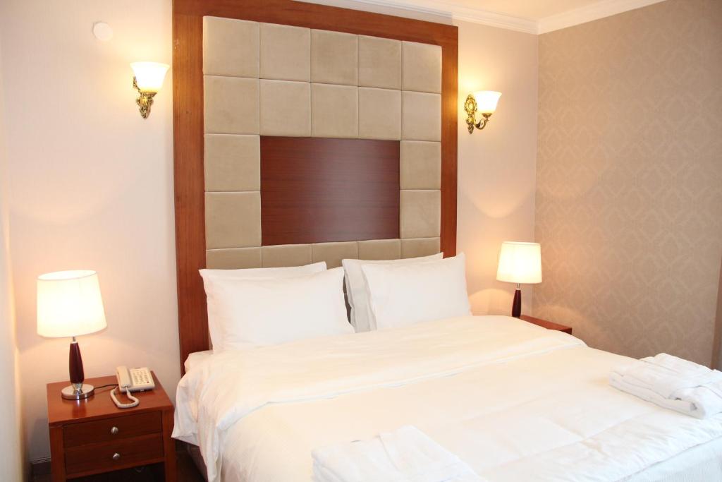 Postel nebo postele na pokoji v ubytování Hotel Park Green