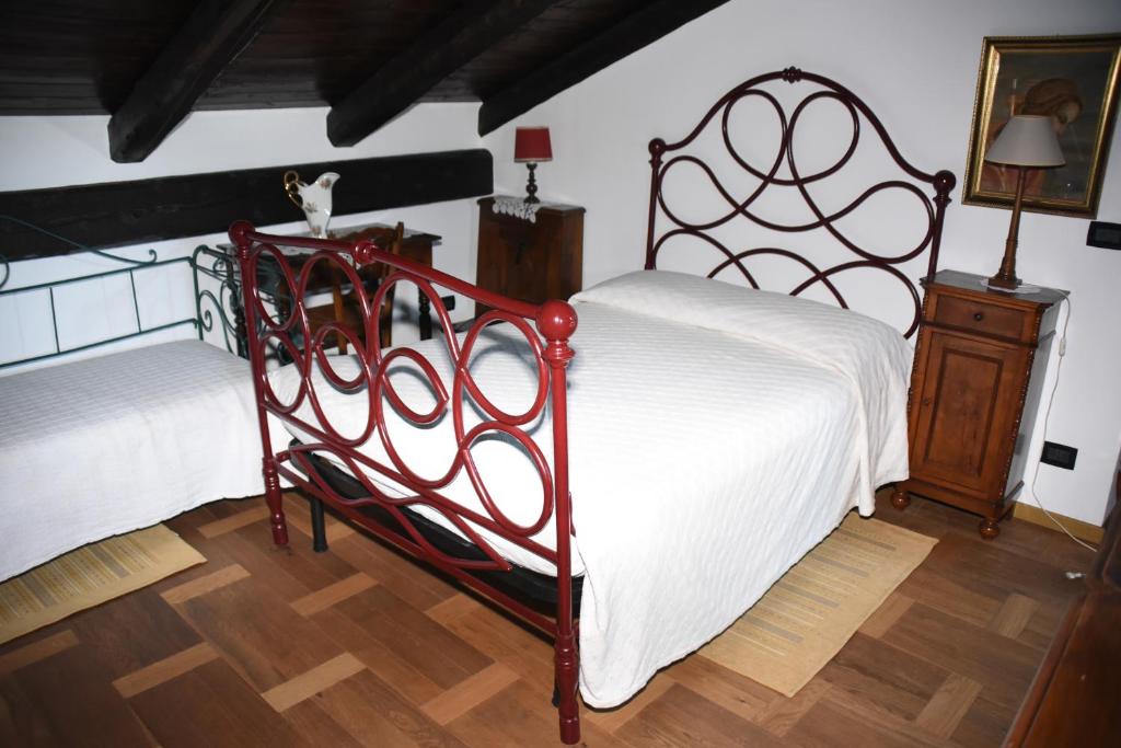 Postel nebo postele na pokoji v ubytování Agriturismo La Ca 'd Majin