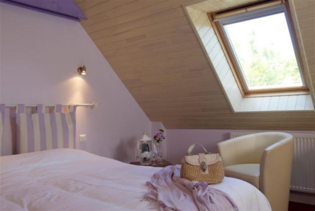 Postel nebo postele na pokoji v ubytování Logis Hotel Belle-Vue