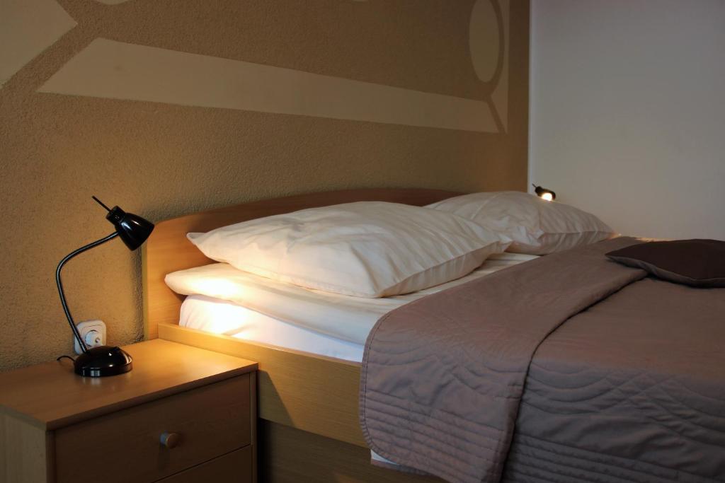 Postel nebo postele na pokoji v ubytování Apartments Koblar