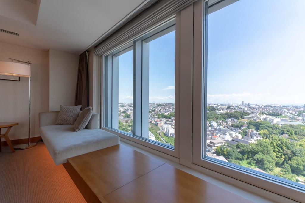Postel nebo postele na pokoji v ubytování Hotel Associa Shin-Yokohama