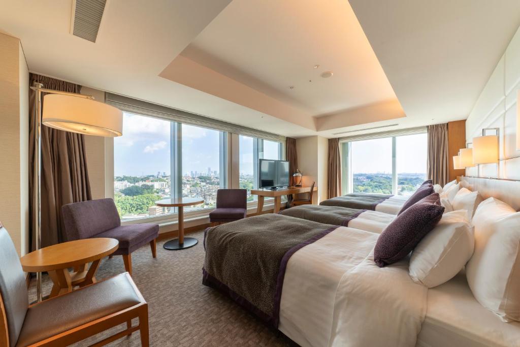 Postel nebo postele na pokoji v ubytování Hotel Associa Shin-Yokohama