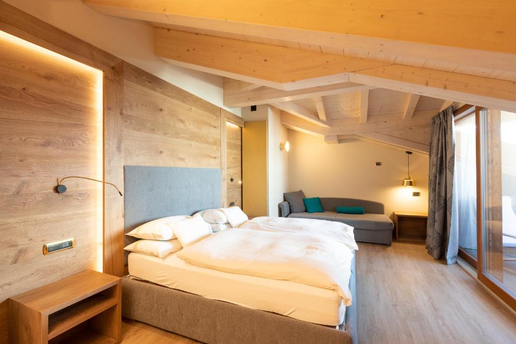 Postel nebo postele na pokoji v ubytování Hotel Cervo