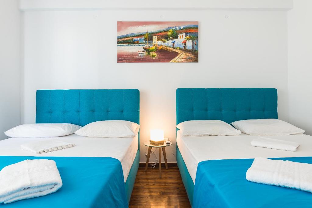 Posteľ alebo postele v izbe v ubytovaní Super Paradise Apartments