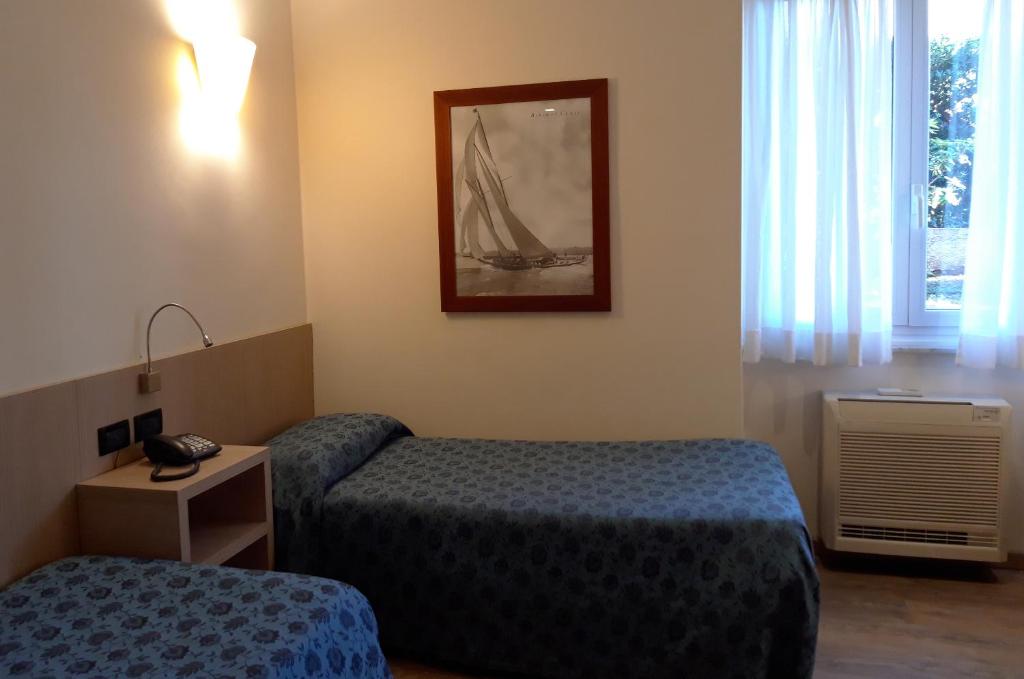 Кровать или кровати в номере Hotel Esperia