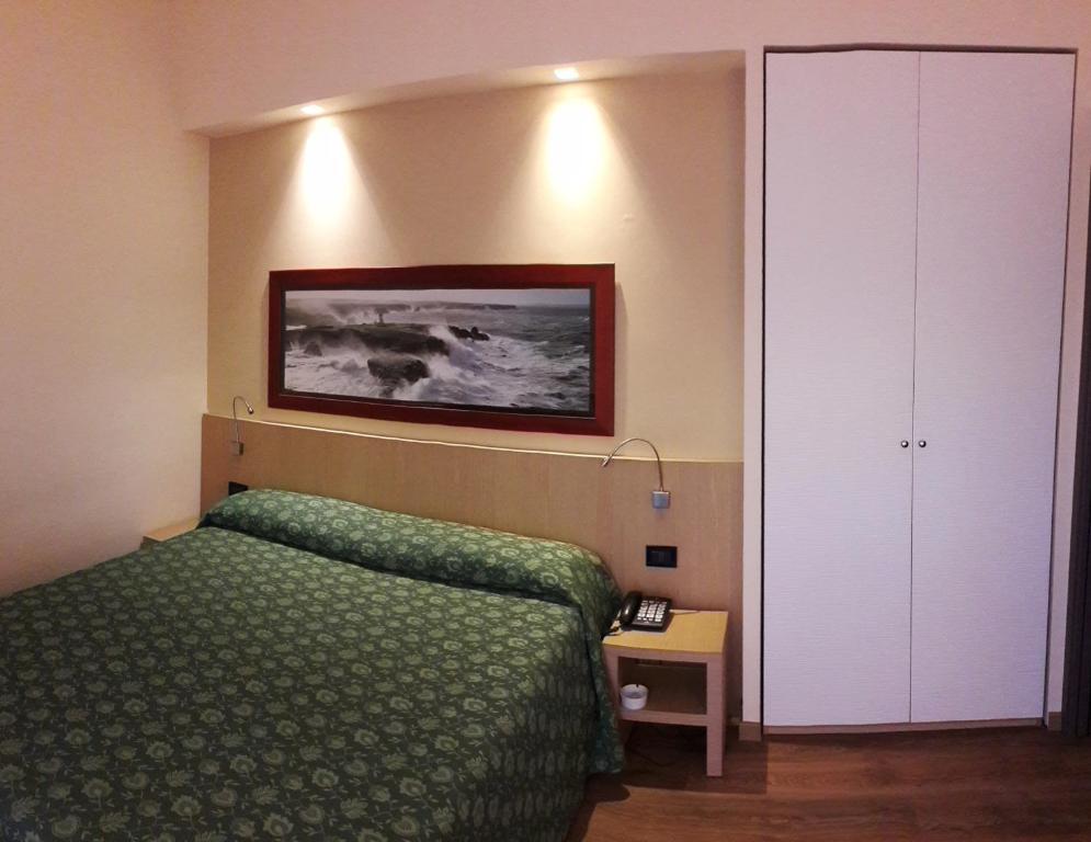 Кровать или кровати в номере Hotel Esperia