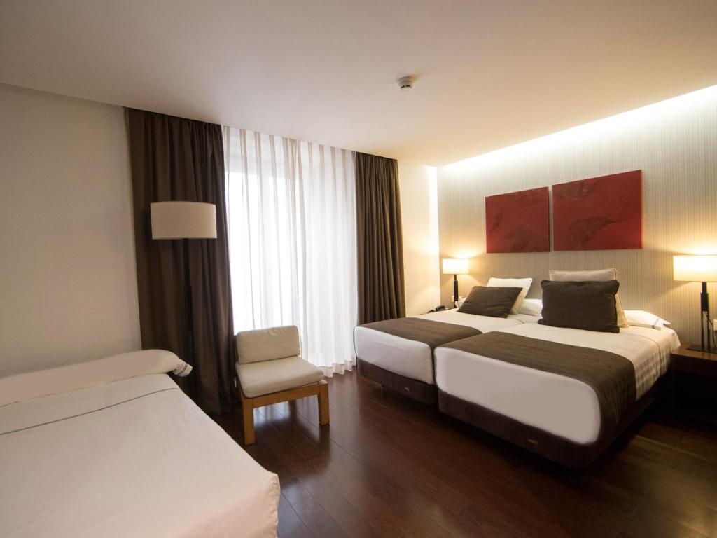 Postel nebo postele na pokoji v ubytování Hotel Carris Porto Ribeira