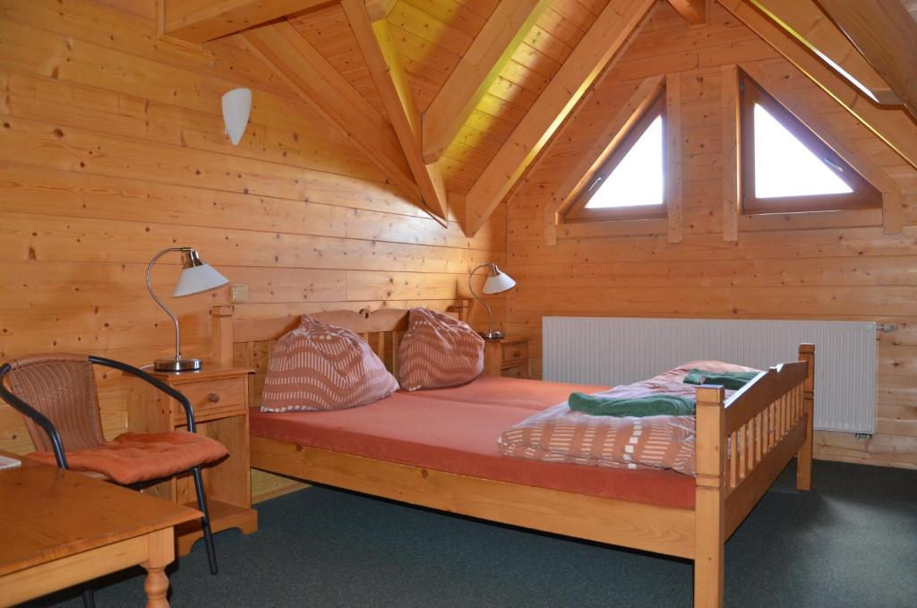 Postel nebo postele na pokoji v ubytování Penzion Haltmar