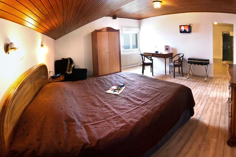Postel nebo postele na pokoji v ubytování Auberge Obersolberg