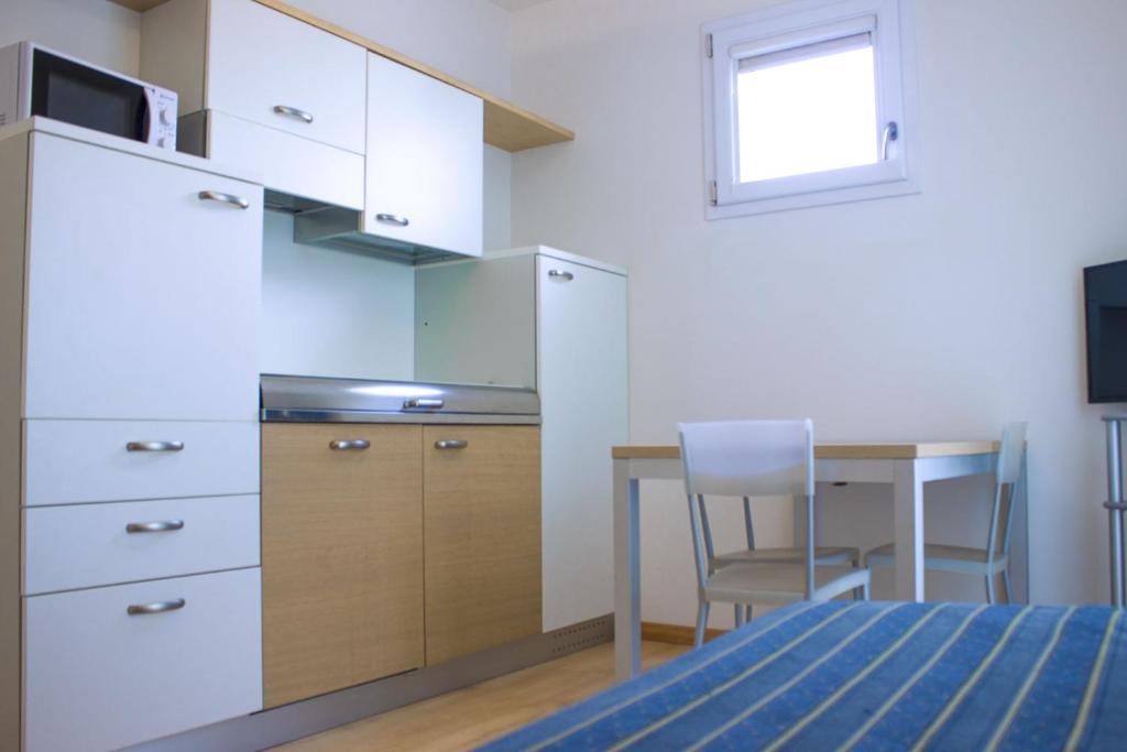 Kuchyň nebo kuchyňský kout v ubytování Aparthotel Royal