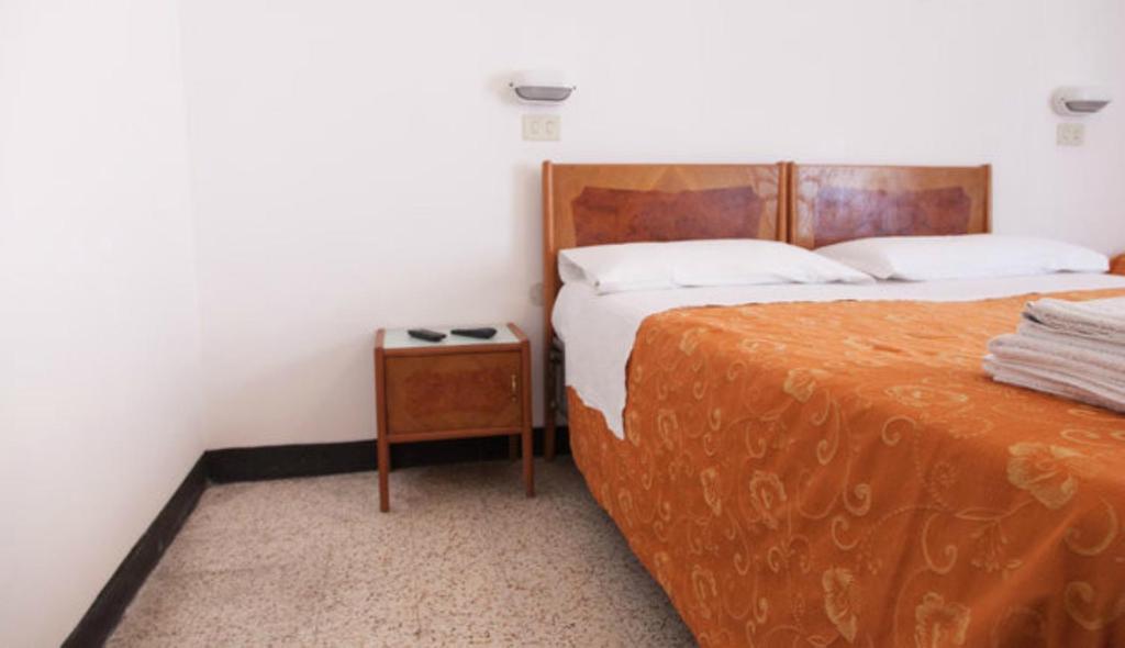 Postel nebo postele na pokoji v ubytování Hotel Ronconi