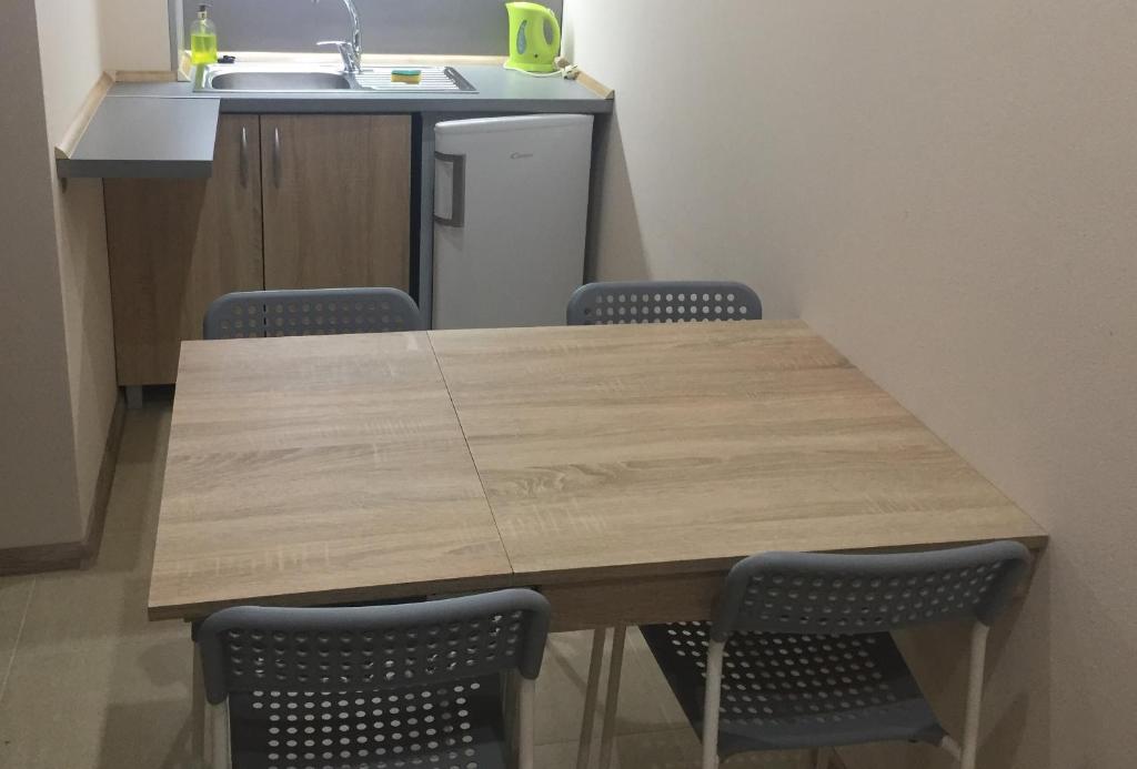 Kuchyň nebo kuchyňský kout v ubytování SUNNY Apartman