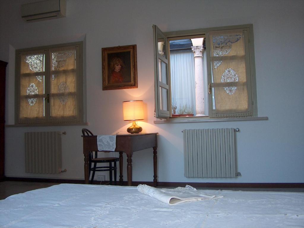 Posteľ alebo postele v izbe v ubytovaní RESIDENZA LEON D'ORO