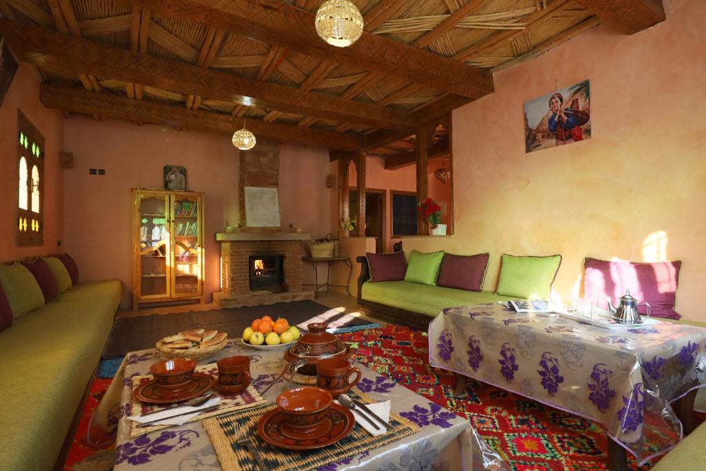 a living room with a couch and a table at Aroumd Authentic Lodge Managed By Rachid Jellah in Imlil