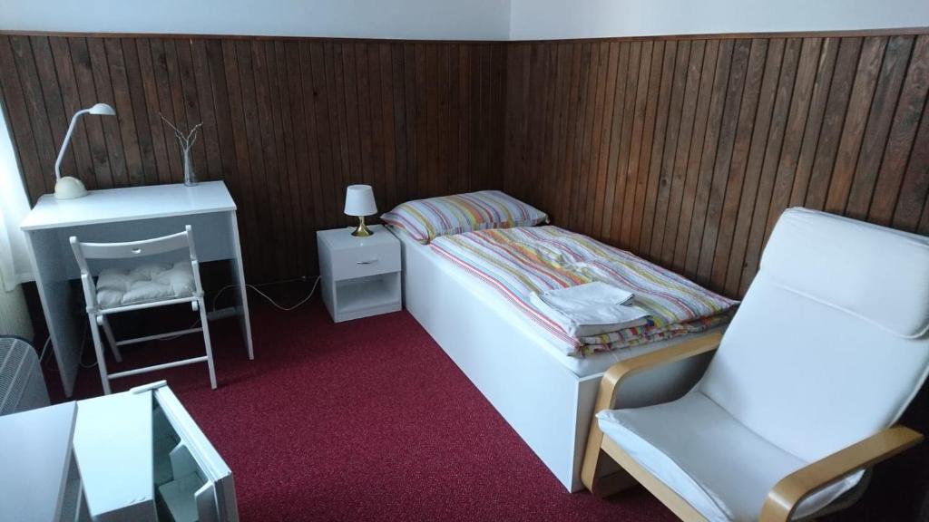 Postel nebo postele na pokoji v ubytování Hotel Šrejber