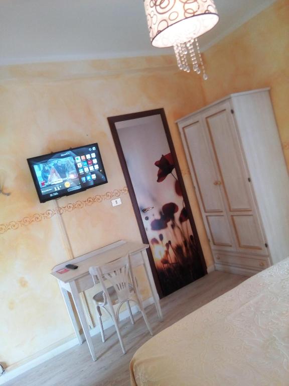 TV a/nebo společenská místnost v ubytování Hotel Eva La Romantica