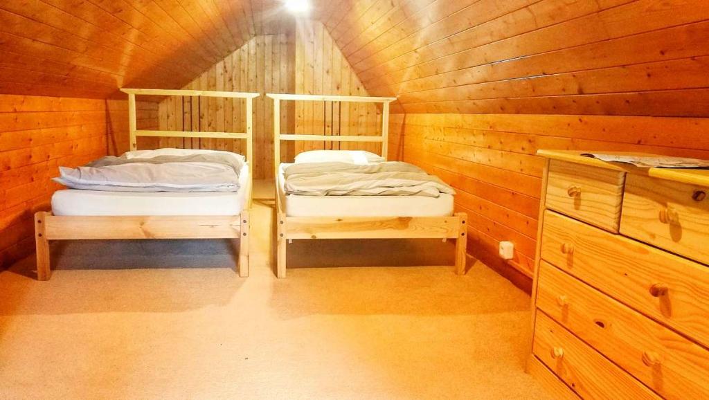 Postel nebo postele na pokoji v ubytování Chata Tatry