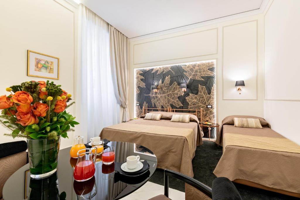A bed or beds in a room at Cavour Suites Guest House