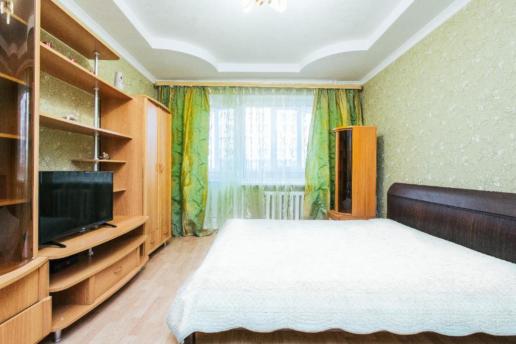 Ліжко або ліжка в номері HomeHotel Молодежный 38/2