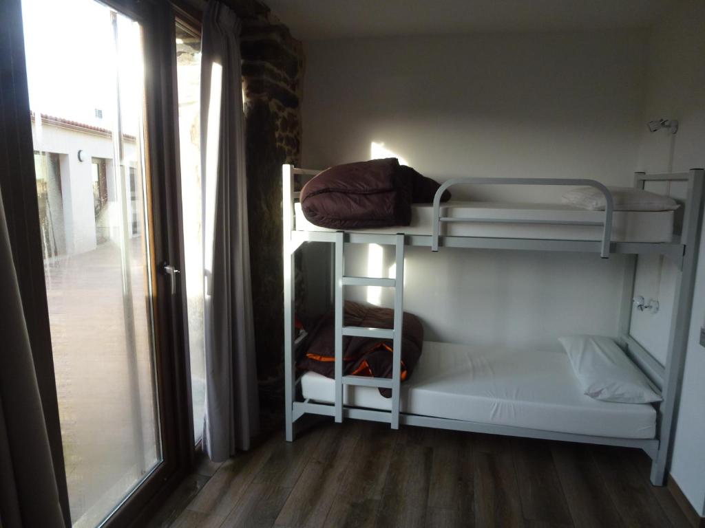 Postel nebo postele na pokoji v ubytování Albergue Monte Aro