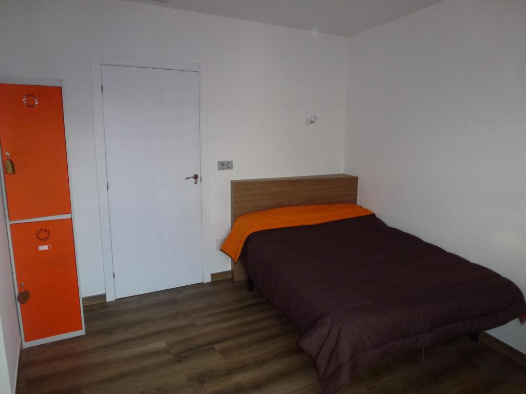 Postel nebo postele na pokoji v ubytování Albergue Monte Aro