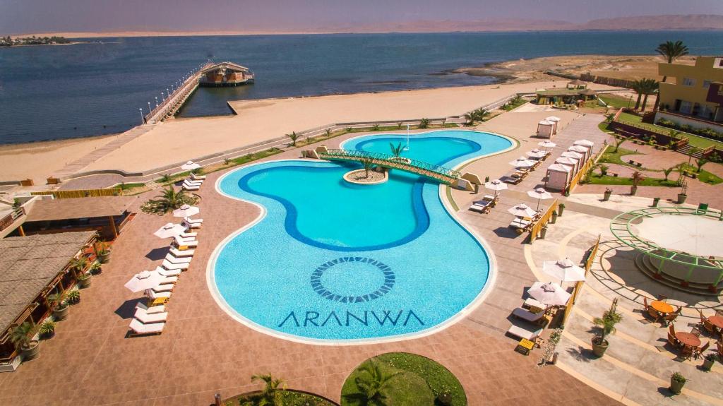 an aerial view of a resort with a large swimming pool at Aranwa Paracas Resort & Spa in Paracas