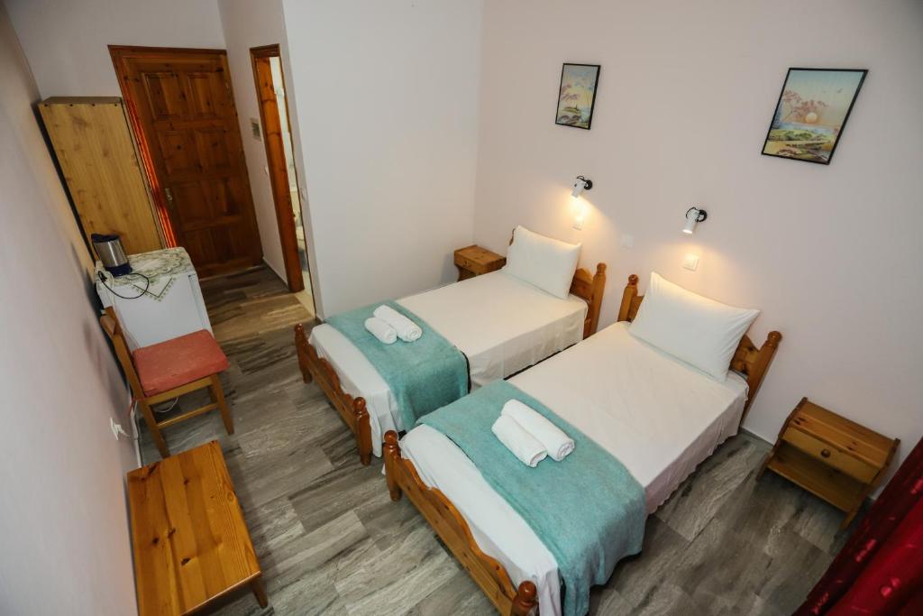 Postel nebo postele na pokoji v ubytování Marianna House