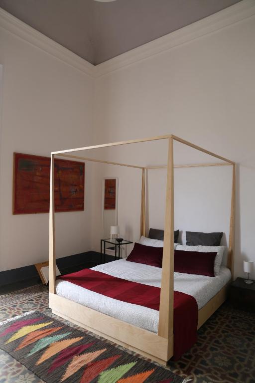 Łóżko lub łóżka w pokoju w obiekcie Trìcora Sicilian B&B