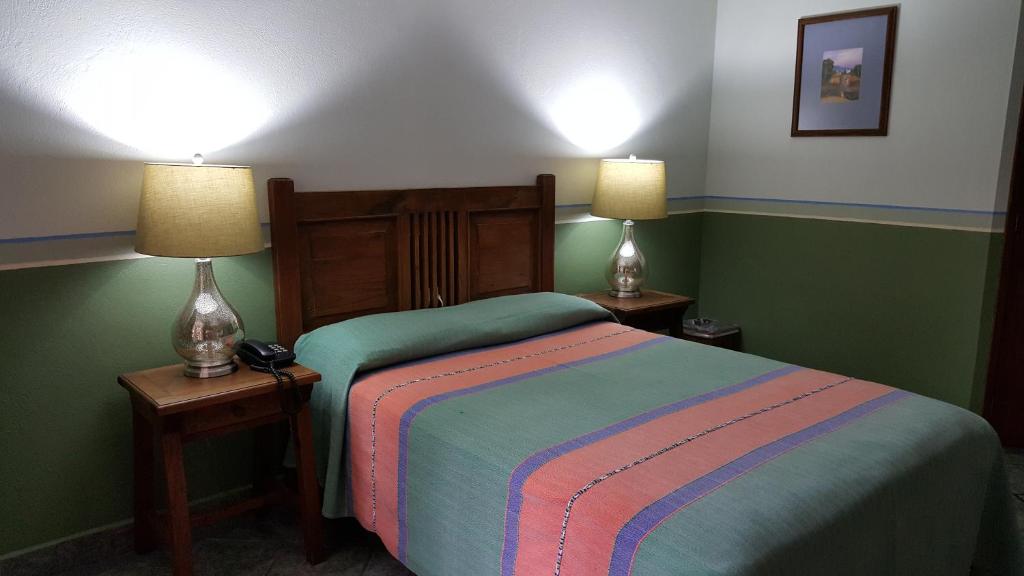 Postel nebo postele na pokoji v ubytování Hotel Posada San Jerónimo