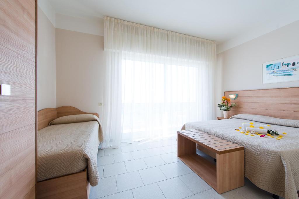 Postel nebo postele na pokoji v ubytování Hotel Giulietta