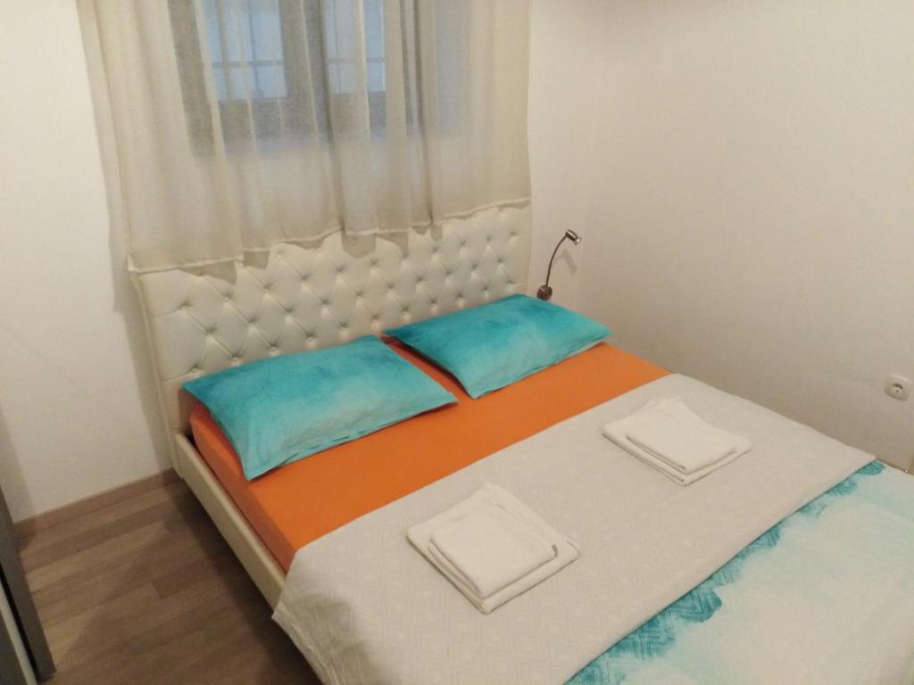 Posteľ alebo postele v izbe v ubytovaní Centar Split Apartments Manuš